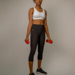 BLACK THREE QUATER SPORTS LEGGINGS AND WHITE BRAT TOP